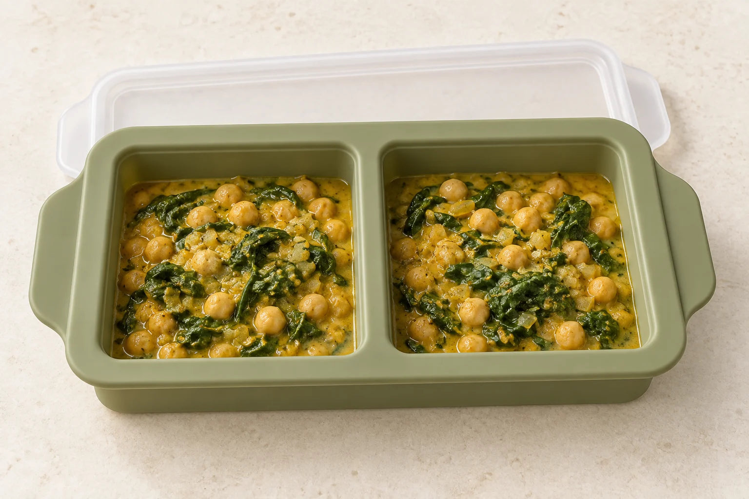 Chickpea & spinach curry portioned in a Olive tray with 2 compartments